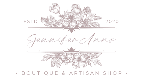 Floral logo for Jennifer Ann's Boutique & Artisan Shop with decorative text on a white background